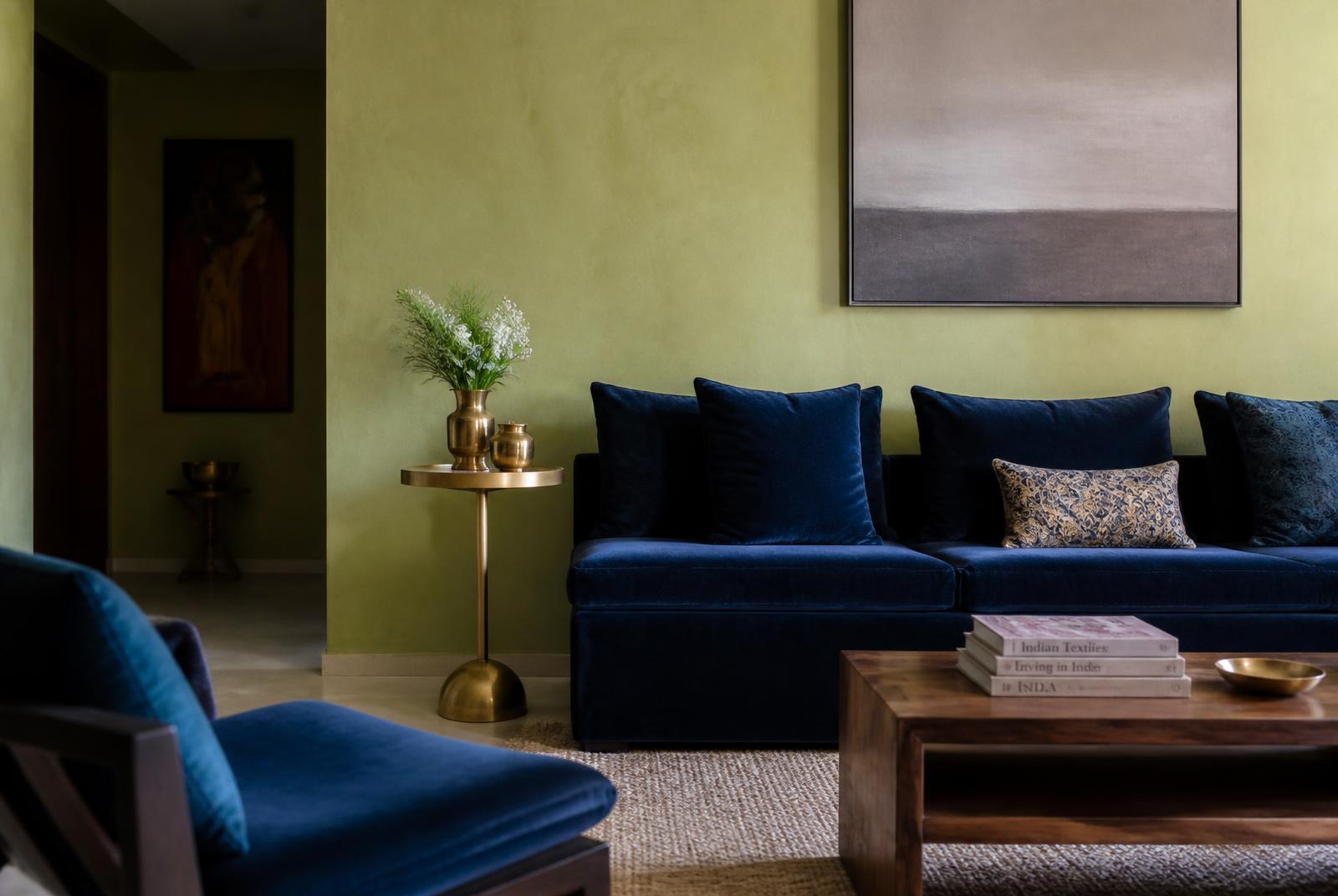 Seating against a textured lime-plaster wall, warm afternoon light